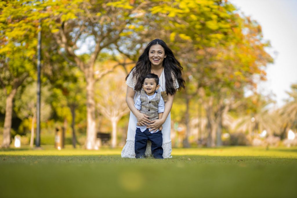 Mother and son smiling during a family photography session in Dubai