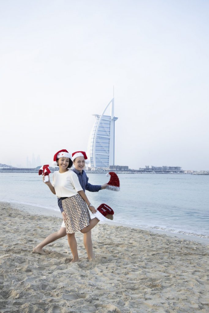 Couple enjoying romantic beach photography in Dubai